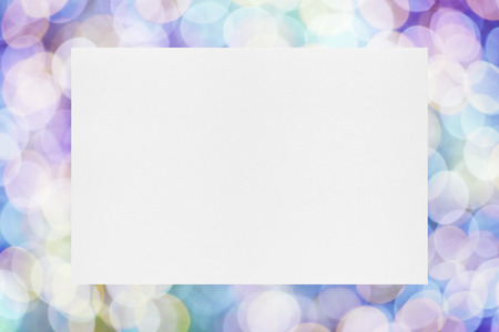 Paper sheet on festive lights backgroundの写真素材