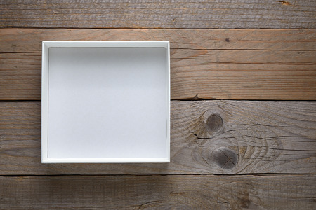Empty white open box on wooden backgroundの写真素材