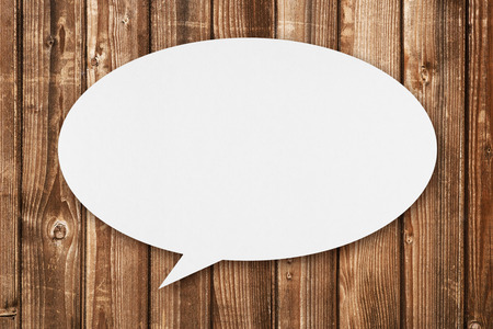 Speech bubble on wooden backgroundの写真素材