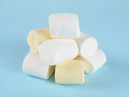 Pile of marshmallow on blue tableの写真素材