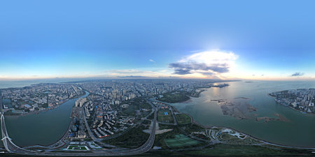Aerial panoramic view of a city at sunset.の写真素材