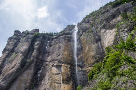 Little waterfalls in a peaceful wood. の写真素材
