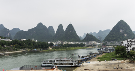 Beautiful karst mountains are visible on blue sky background on summer sunny day.のeditorial素材