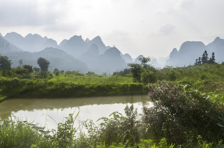 karst mountains are visible on blue sky background on summer sunny day.の写真素材