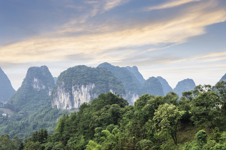 karst mountains are visible on blue sky background on summer sunny day.の写真素材