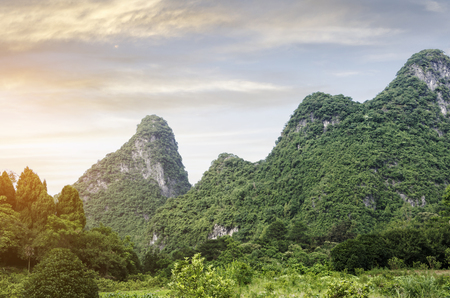 karst mountains are visible on blue sky background on summer sunny day.の写真素材