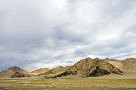 Dangerous mountain road at Ladakh India with view of scenic landscape and Himalayan mountain ranges.の写真素材