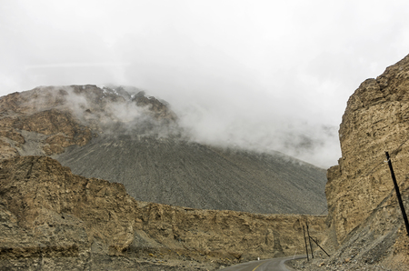 Dangerous mountain road at Ladakh India with view of scenic landscape and Himalayan mountain ranges.の写真素材
