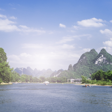 karst mountains are visible on blue sky background on summer sunny day.の写真素材