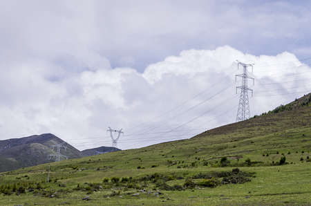 High-voltage electric wires under the blue skyの写真素材