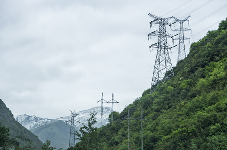 High-voltage electric wires under the skyの写真素材