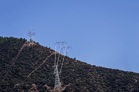 High-voltage electric tower under the blue skyの写真素材