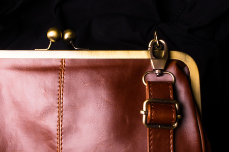 closeup of the fittings on the brown leather hand bag