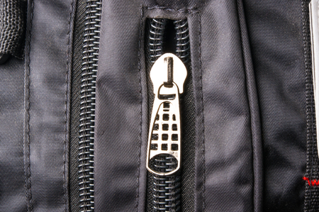 closeup of a pockets in the black backpackの写真素材