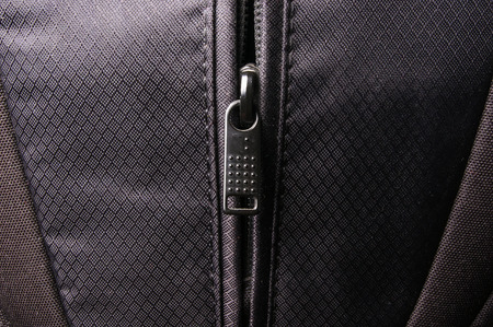 closeup of a pockets in the black photobackpackの写真素材