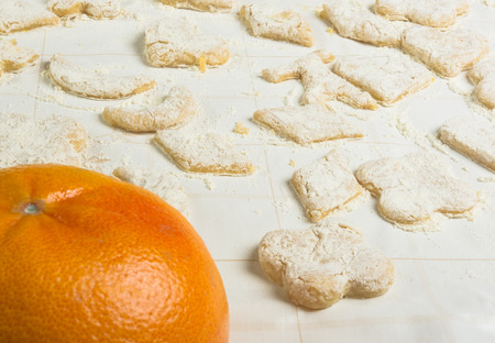 making homemade sugar cookies - grapefruit, form a dough and the flour on the tableの写真素材