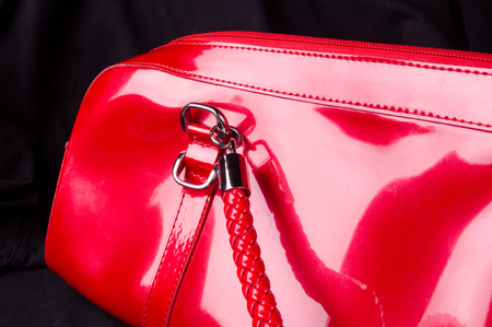 closeup of the fittings on the red lacquer hand bagの写真素材