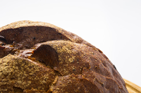 dark bread with crumbs on wood board