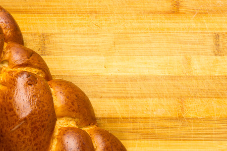 chunks large braided loaf on wooden background