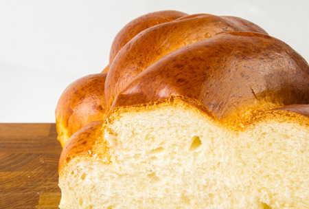 chunks large braided loaf on wooden backgroundの写真素材