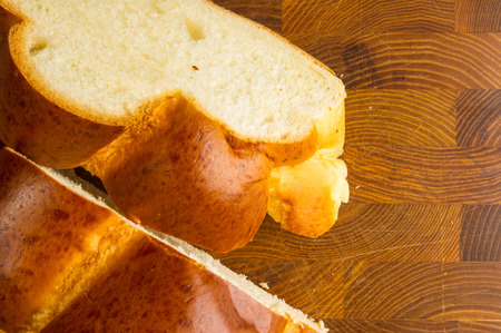 chunks large braided loaf on wooden background