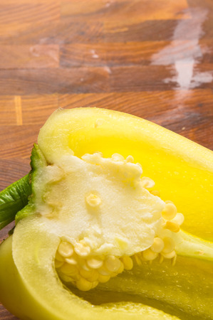 still life - yellow pepper on wooden Boardの写真素材