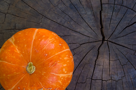 background for Halloween holiday - decorative orange pumpkin on old wooden backgroundの写真素材