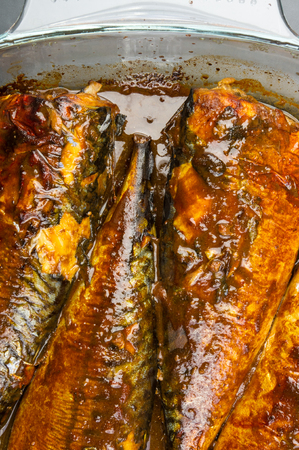 Mackerel in marinade, baked in a glass containerの写真素材