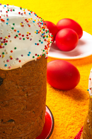Kulichi, traditional Russian Easter cake with icing and dyed eggsの写真素材