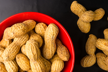 Peanuts in shell on dark background, close upの写真素材