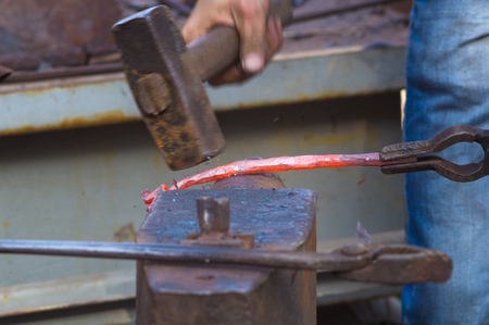 a blacksmith makes of hot metal unique iron rose handmadeの写真素材