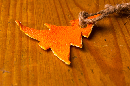 New Year Concept. Christmas decorations hand made from tangerine peel on wooden backgroundの写真素材
