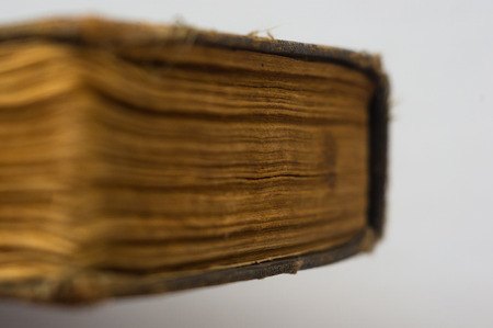 Part of the old tattered books with yellowed pages, macro, close upの写真素材