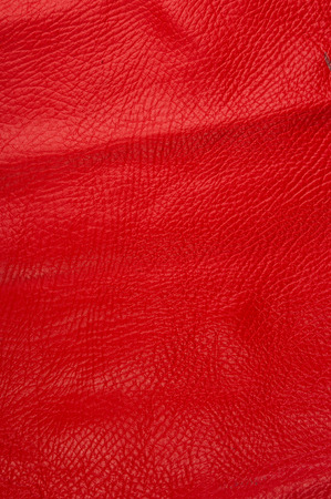 red natural leather texture background, closeup, macroの写真素材