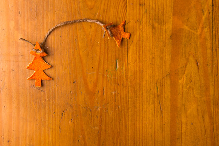 New Year Concept. Christmas decorations hand made from tangerine peel on wooden backgroundの写真素材