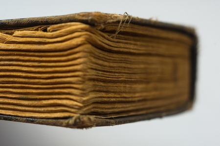 Part of the old tattered books with yellowed pages, macro, close upの写真素材