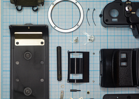 parts old retro film SLR camera on graph paperの写真素材