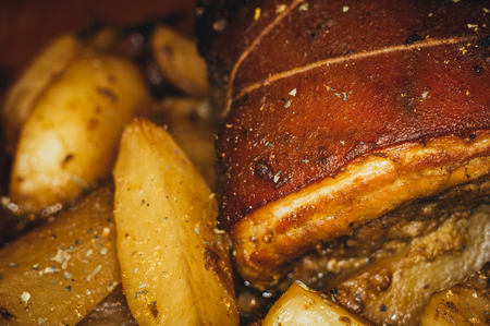 Roulade of bacon with mushrooms and potatoes baked in the ovenの写真素材
