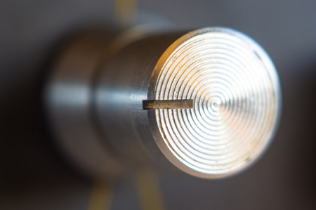 aluminum control knobs retro home audio system, macro, close upの写真素材