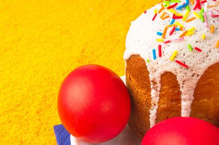 Kulichi, traditional Russian Easter cake with icing and dyed eggs
