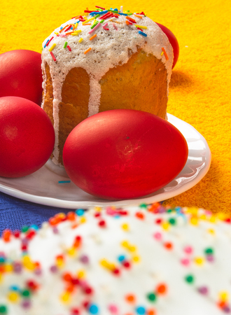 Kulichi, traditional Russian Easter cake with icing and dyed eggs