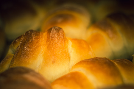 Fresh homemade croissants with sweet filling, before baking in the oven, selective focus