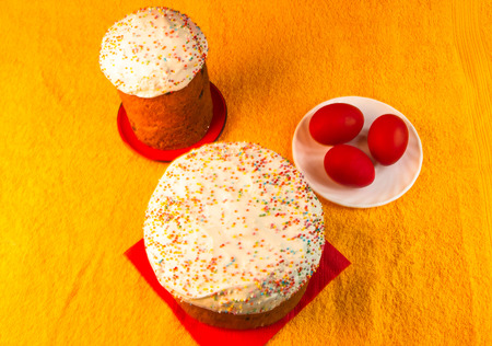 Kulichi, traditional Russian Easter cake with icing and dyed eggsの写真素材