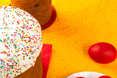 Kulichi, traditional Russian Easter cake with icing and dyed eggs