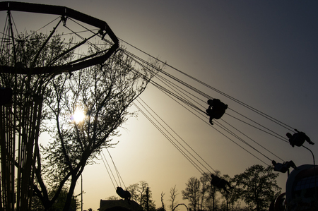 attractions in spring city Park - blooming flower and trees, bright green grass, sunlightの写真素材