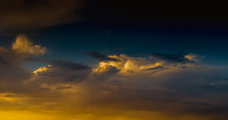 Landscape with dramatic light - beautiful golden sunset with saturated sky and clouds, peaceful...