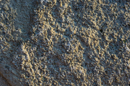 rock formations and stones of the sea coast, weathered and smoothed by wavesの写真素材