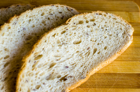 sliced whole wheat breads on a chopping Board