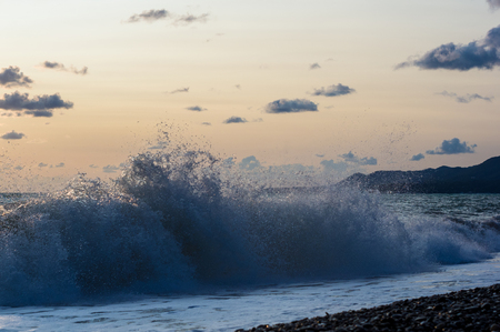 Summer sea sunset, the sun, waves and clouds, beautiful dramatic lightingの写真素材