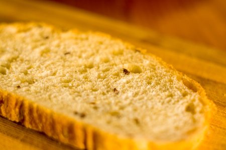 sliced whole wheat breads on a chopping Boardの写真素材